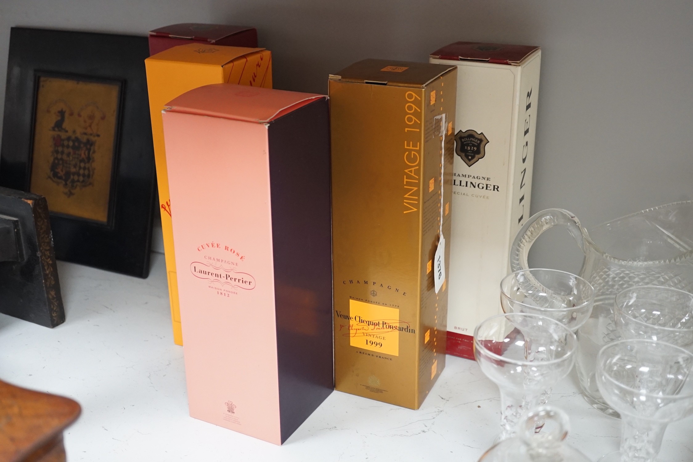 A boxed bottle of Veuve Clicquot 1999 vintage Champagne, a similar boxed NV Champagne, two boxed Bollinge Special Cuvee NV Champagne and a boxed Laurent Perrier NV Champagne.